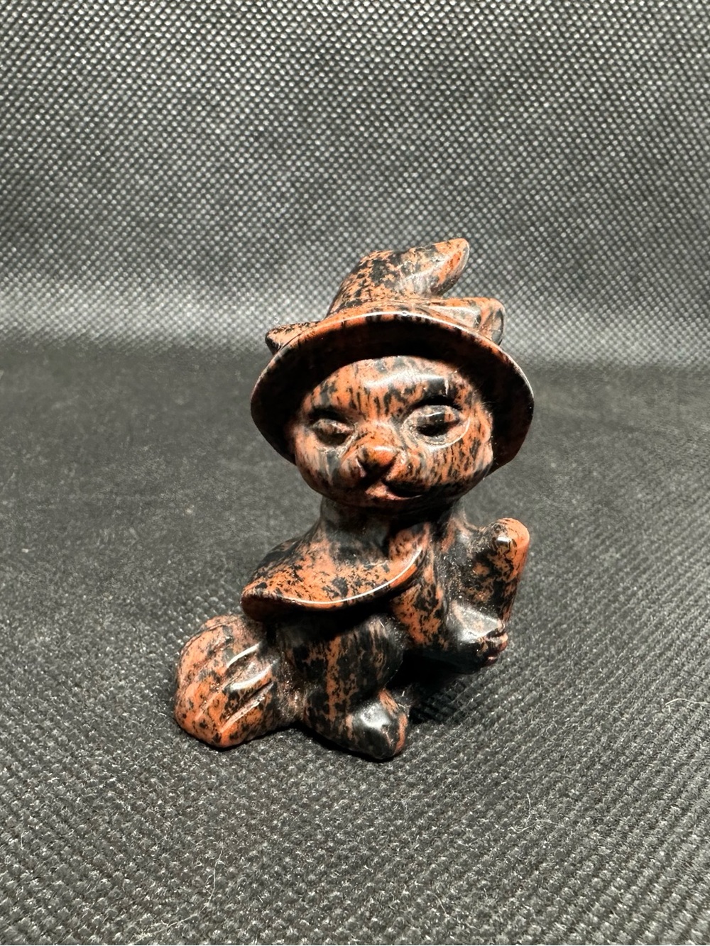 Mahogany obsidian witch cat on a broom